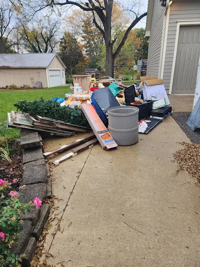 Dumpster being loaded with debris for 30 Yard Dumpster Rental in Pittsford